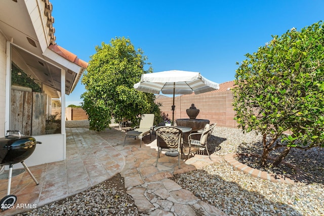 view of patio featuring a fenced backyard and area for grilling