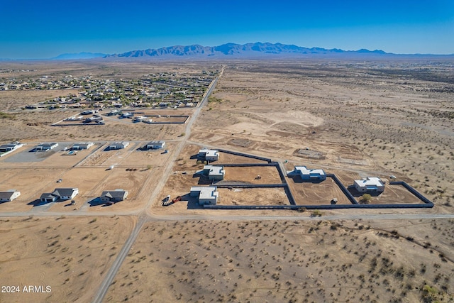 drone / aerial view with a rural view, a desert view, and a mountain view
