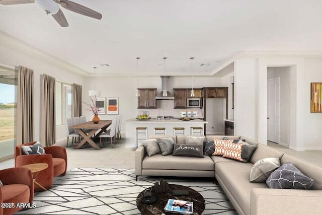 living room featuring a ceiling fan
