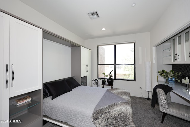 carpeted bedroom featuring a closet