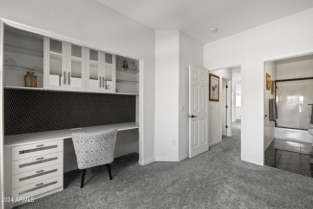 unfurnished office featuring dark colored carpet