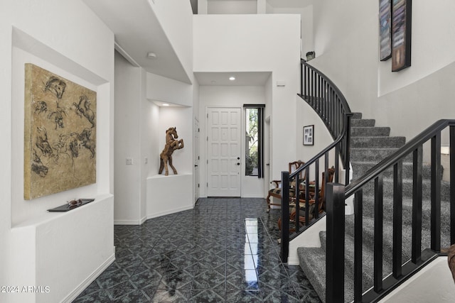 foyer entrance with a high ceiling