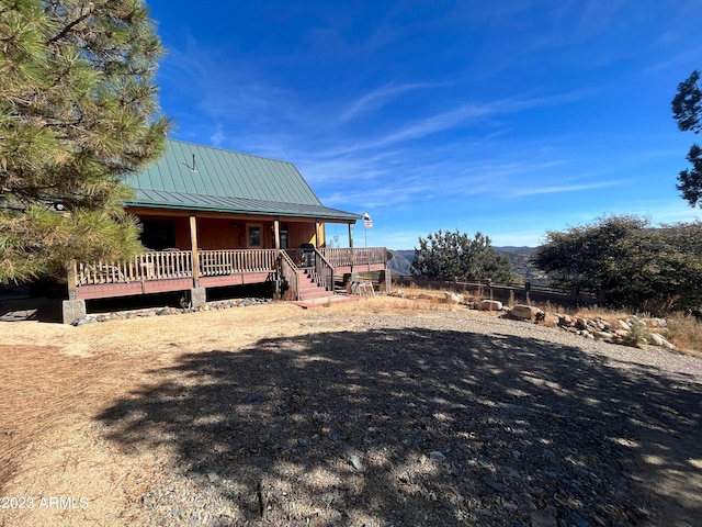 view of front of house with a wooden deck