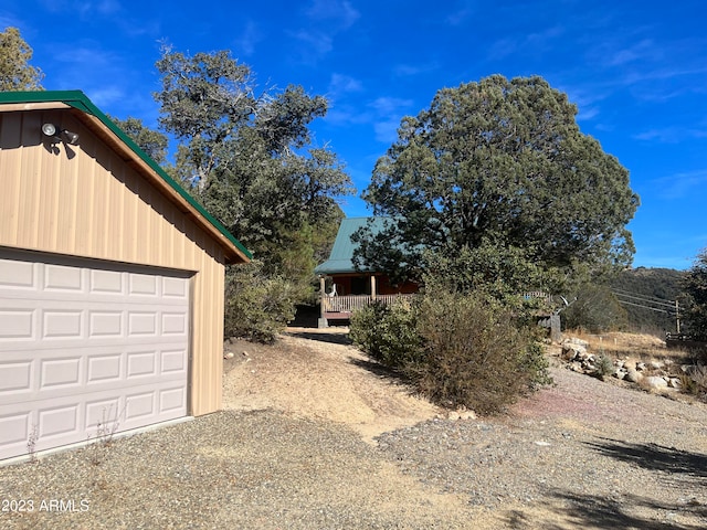 exterior space with an outbuilding and a garage