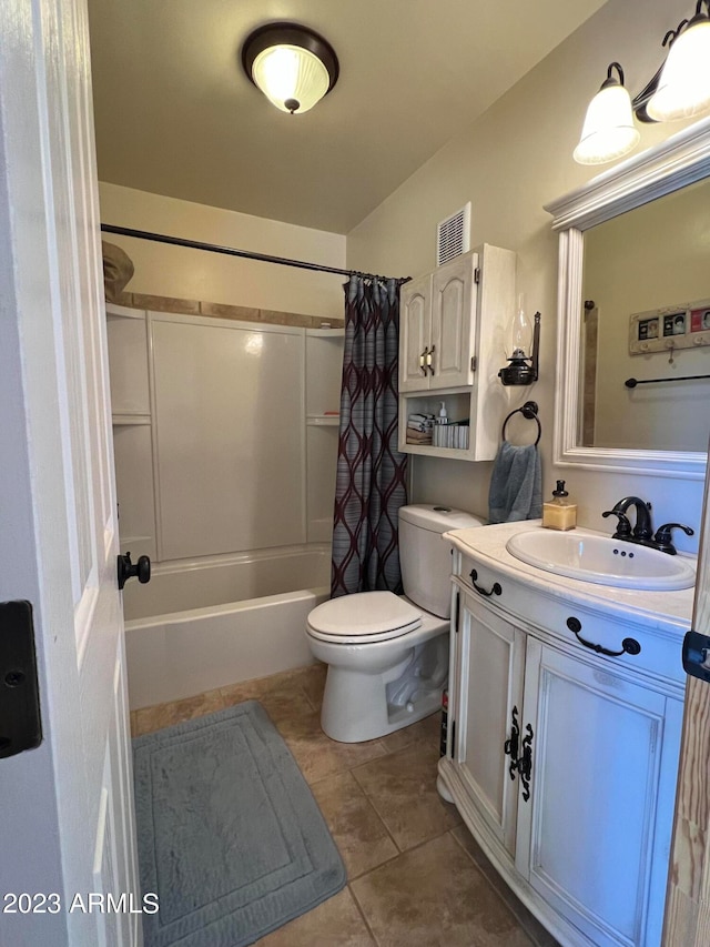 full bathroom with vanity, shower / bath combo with shower curtain, toilet, and tile patterned floors