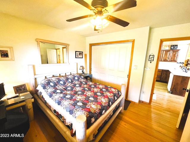 bedroom with a closet, ceiling fan, and wood-type flooring