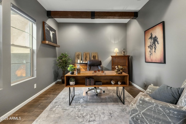 office space with beam ceiling