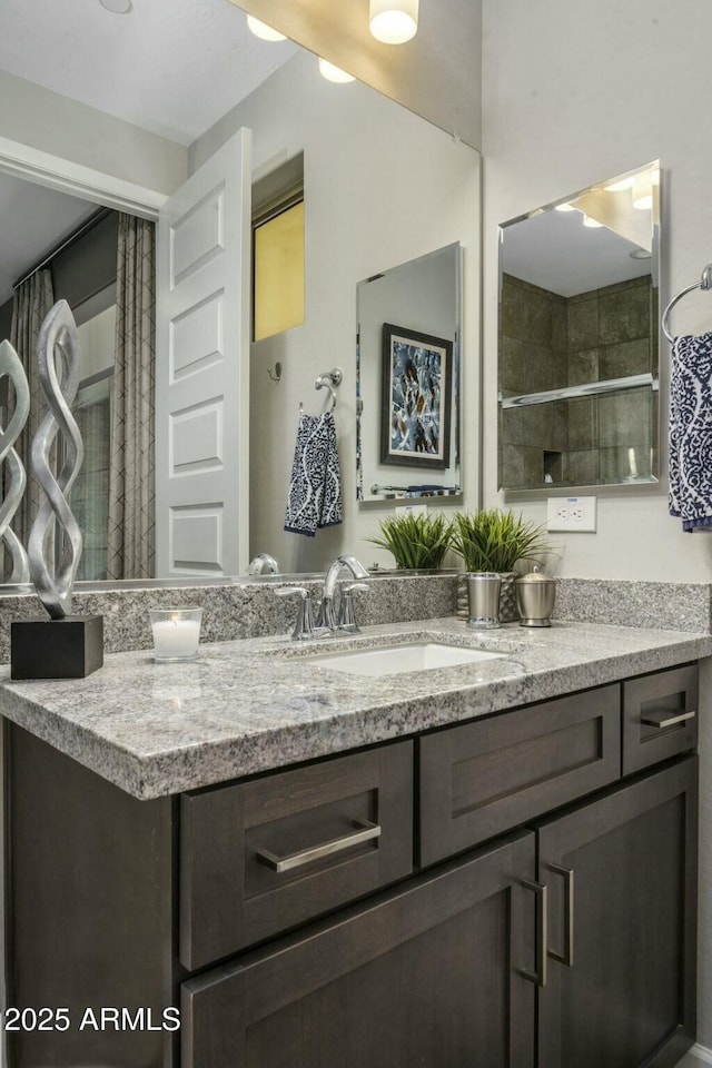 bathroom featuring vanity and walk in shower