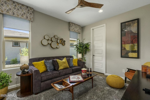 living room with ceiling fan and wood-type flooring