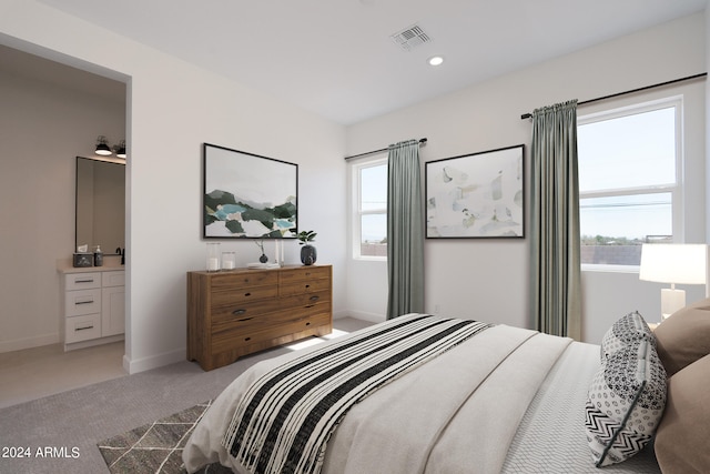 bedroom featuring multiple windows and light colored carpet