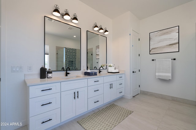 bathroom with vanity, tile patterned floors, and walk in shower