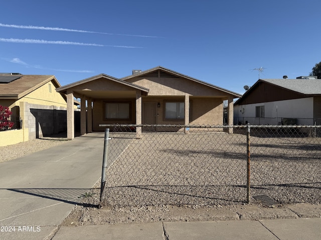 view of front of home with a carport