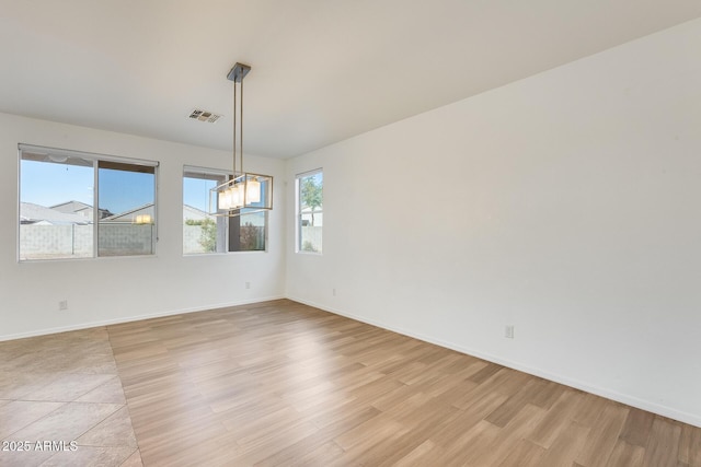 unfurnished room featuring light hardwood / wood-style floors