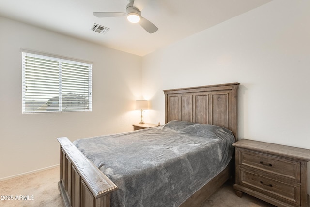 bedroom featuring light carpet and ceiling fan