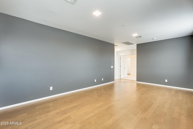 unfurnished room with light hardwood / wood-style flooring