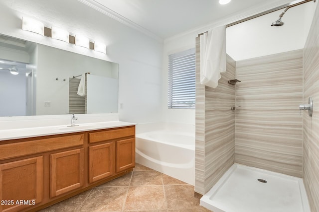 bathroom featuring shower with separate bathtub, vanity, tile patterned floors, and crown molding