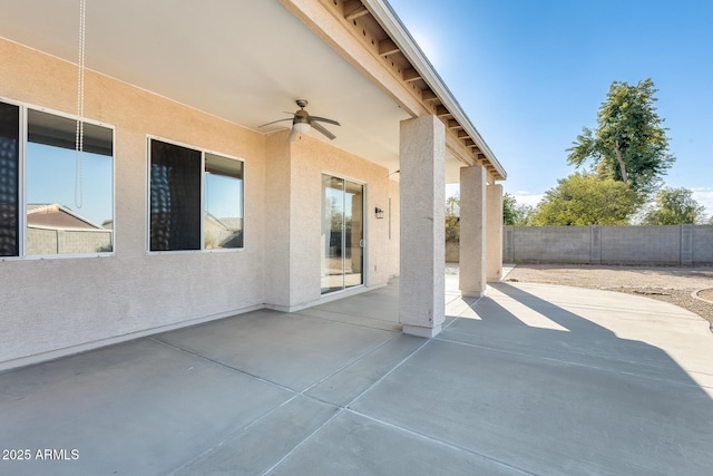 view of patio featuring ceiling fan