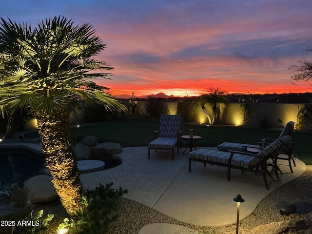 patio terrace at dusk with a water view