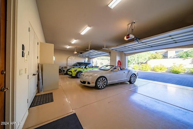 garage featuring a carport and a garage door opener