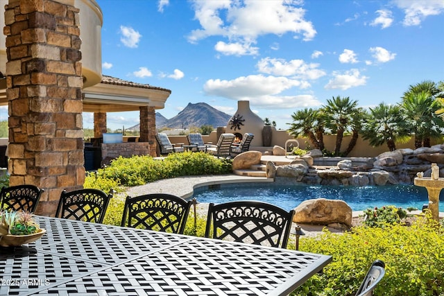 view of swimming pool featuring a mountain view