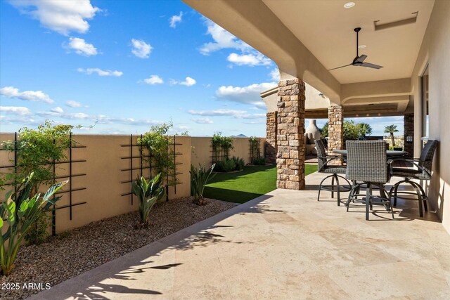 view of patio with ceiling fan