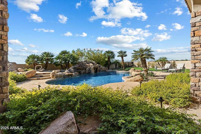 view of pool featuring a patio and pool water feature