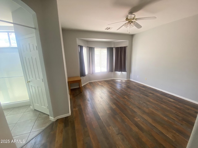 3559 N 143rd Ave, Goodyear, AZ 85395 - empty room featuring a ceiling fan, hardwood / wood-style flooring, and baseboards