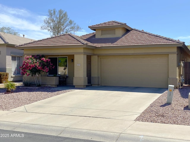 3559 N 143rd Ave, Goodyear, AZ 85395 - prairie-style home featuring an attached garage, a tile roof, driveway, stucco siding, and a porch