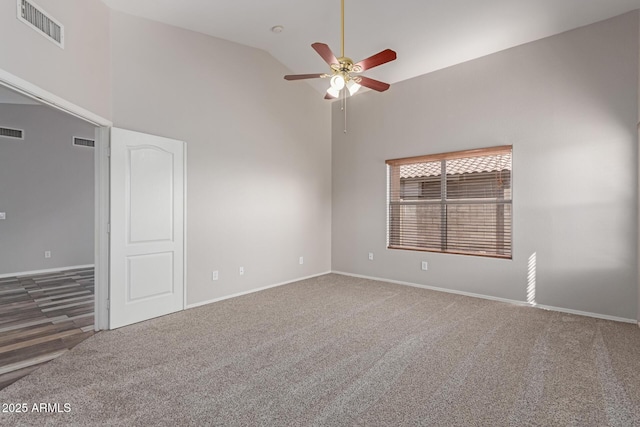 spare room with visible vents, high vaulted ceiling, carpet, and a ceiling fan