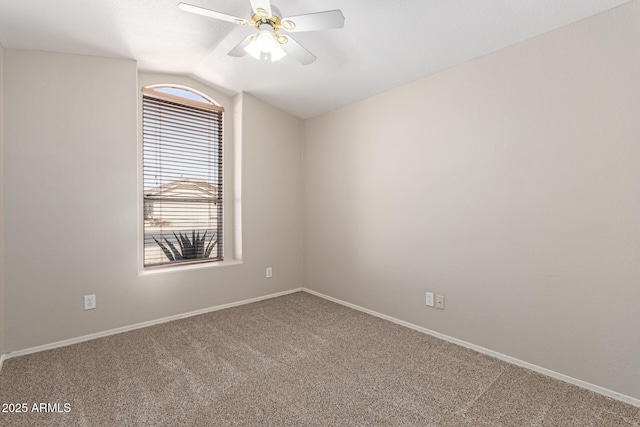 unfurnished room featuring baseboards, carpet, a ceiling fan, and vaulted ceiling