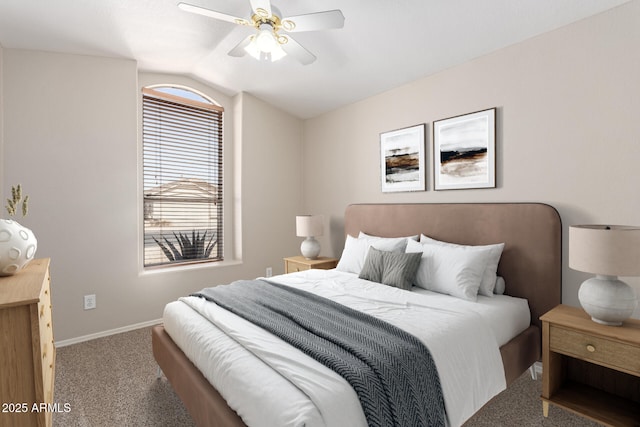 carpeted bedroom with vaulted ceiling, baseboards, and ceiling fan