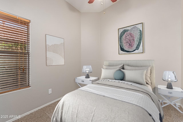 carpeted bedroom featuring baseboards and ceiling fan