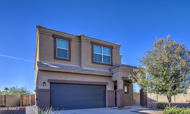 view of front of property with a garage