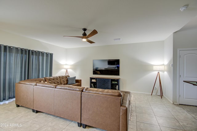 tiled living room with ceiling fan