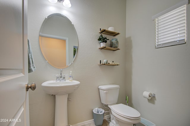 bathroom featuring sink and toilet