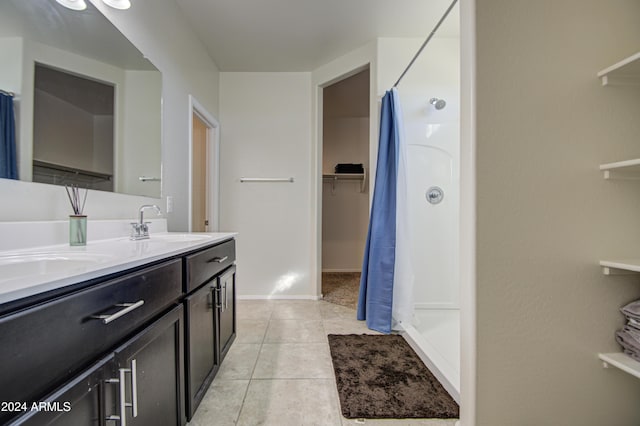 bathroom with tile patterned flooring, vanity, and a shower with shower curtain