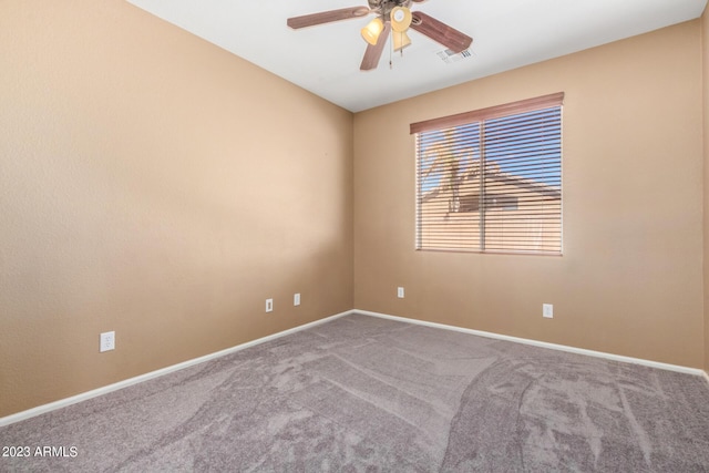 empty room featuring visible vents, baseboards, carpet, and a ceiling fan