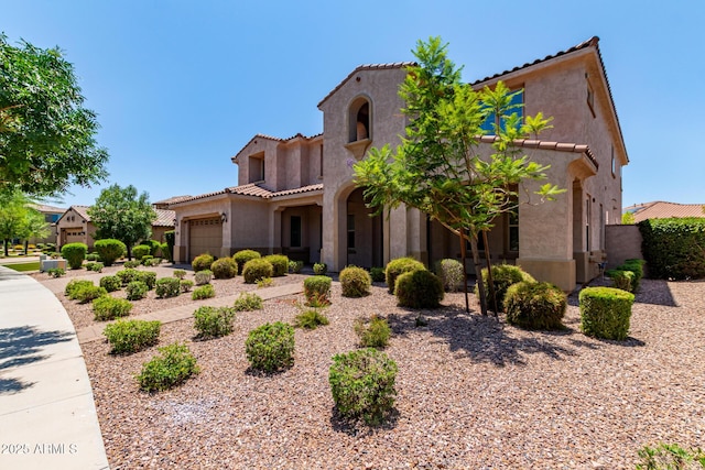 4724 S Anitole Way, Mesa, AZ 85212 - mediterranean / spanish-style house with an attached garage, stucco siding, and a tiled roof