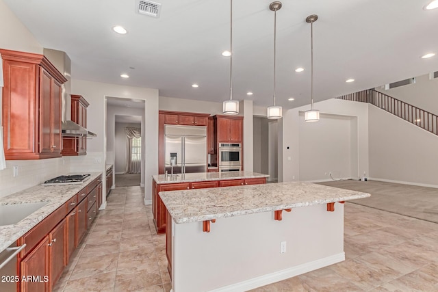 4724 S Anitole Way, Mesa, AZ 85212 - kitchen with appliances with stainless steel finishes, a center island, a breakfast bar area, recessed lighting, and pendant lighting