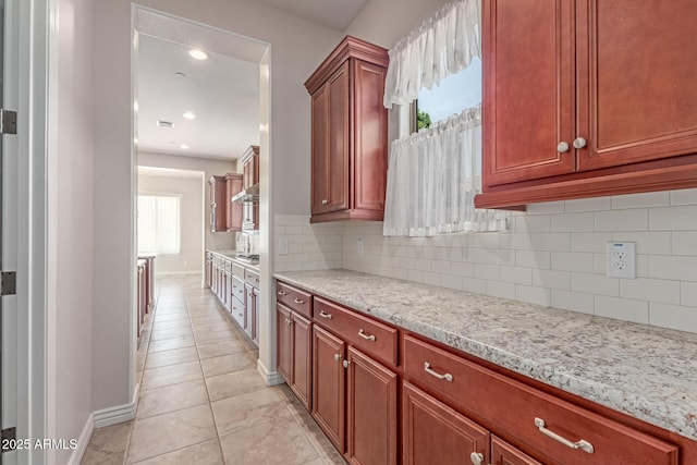 4724 S Anitole Way, Mesa, AZ 85212 - kitchen featuring tasteful backsplash, light stone countertops, recessed lighting, light tile patterned flooring, and extractor fan
