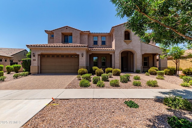 4724 S Anitole Way, Mesa, AZ 85212 - mediterranean / spanish-style home with driveway, stucco siding, a tile roof, and an attached garage