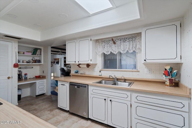 kitchen with sink, tasteful backsplash, dishwasher, light hardwood / wood-style floors, and white cabinets