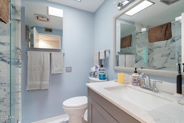 bathroom featuring walk in shower, vanity, and toilet