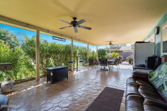 view of patio with outdoor lounge area and ceiling fan