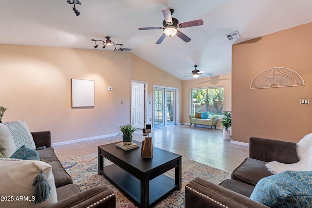 living room with lofted ceiling and french doors