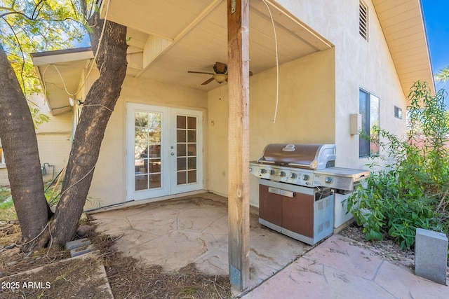 view of patio featuring french doors, ceiling fan, and an outdoor kitchen