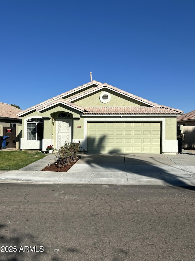 ranch-style home featuring a garage