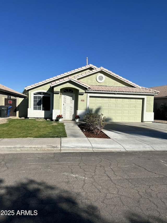 ranch-style home featuring a garage