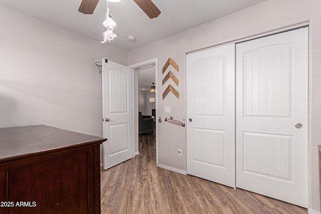 20750 E Chase Ct, Florence, AZ 85132 - unfurnished bedroom with wood finished floors, a closet, and ceiling fan