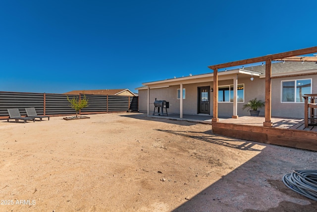 20750 E Chase Ct, Florence, AZ 85132 - back of property with stucco siding, a patio area, and a wooden deck